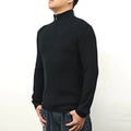 Man wearing a grey cotton blend half-turtleneck zip sweater with long sleeves