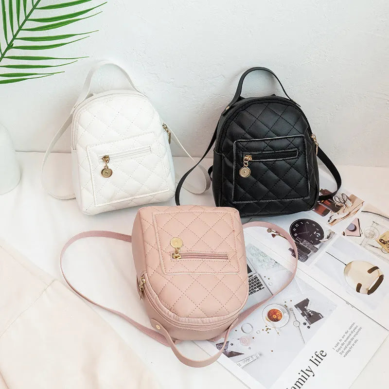 Hardback square Korean style embroidered girls' backpack in pink with soft handle.
