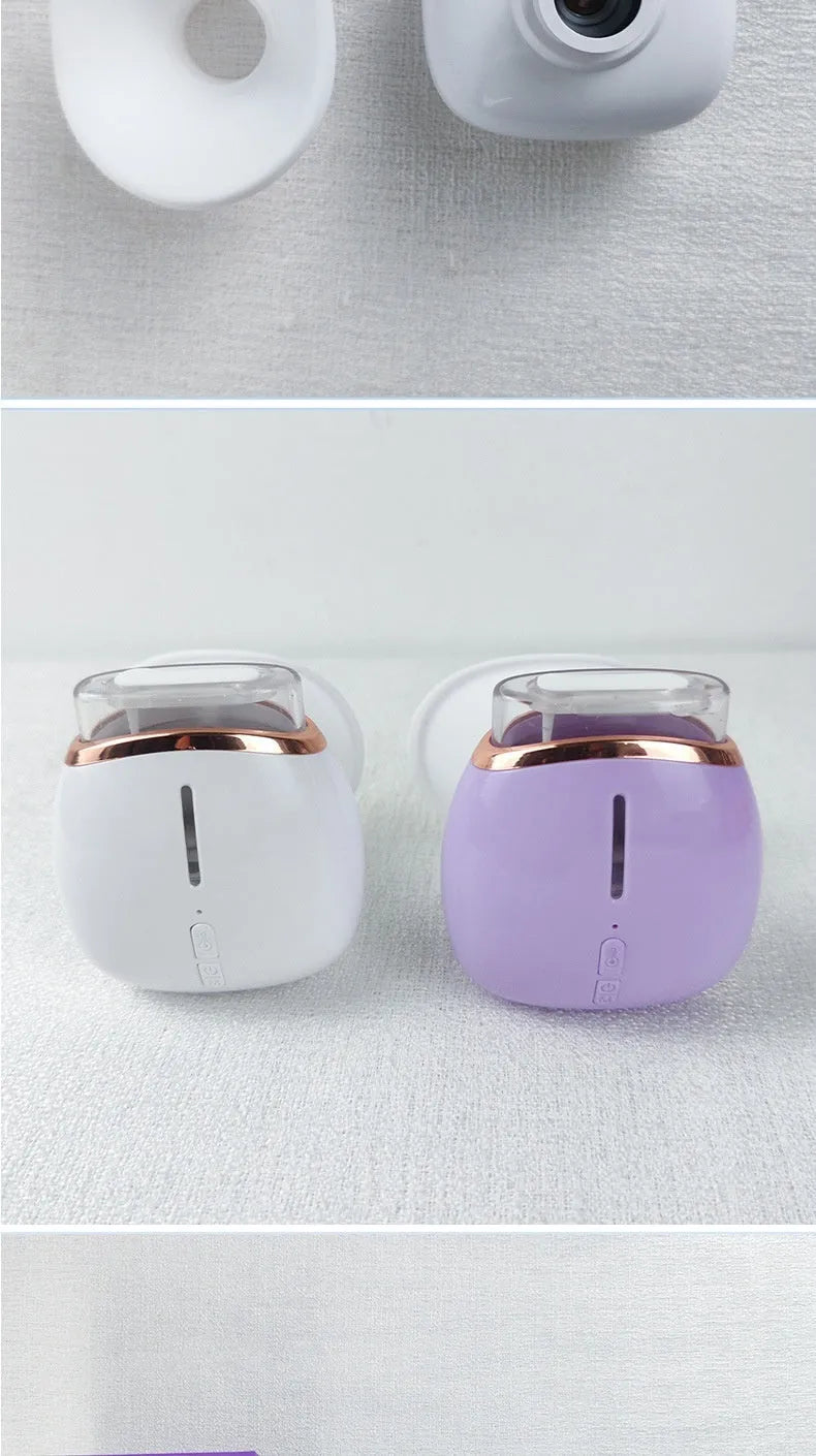 White portable eye humidifier with USB charging cable on wooden table