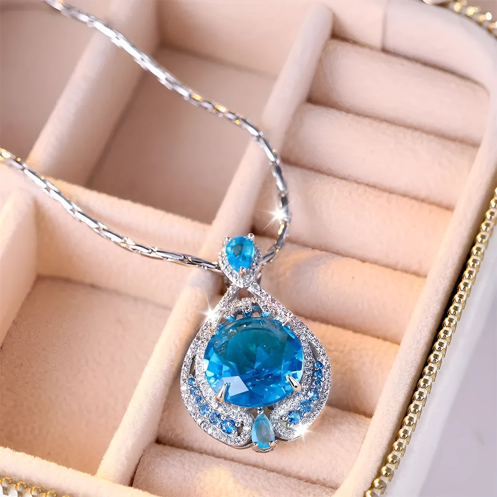 Blue geometric women's necklace with fireworks cut gems on water wave chain