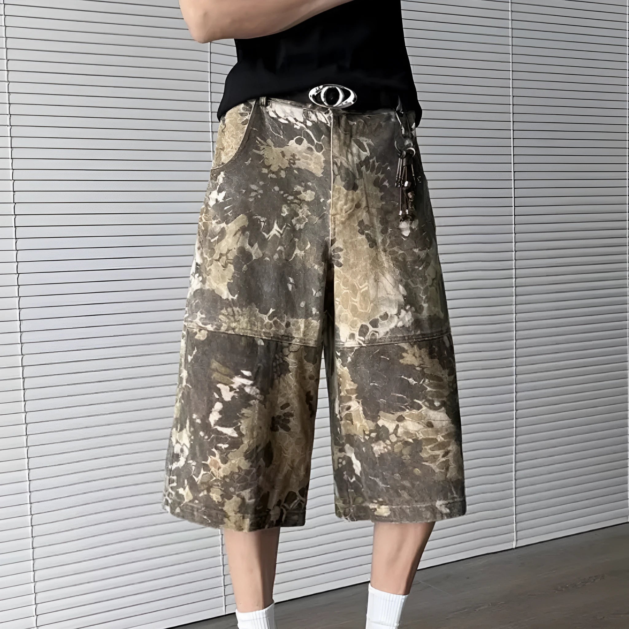 Women's yellow snake camouflage print cropped jeans on a model.