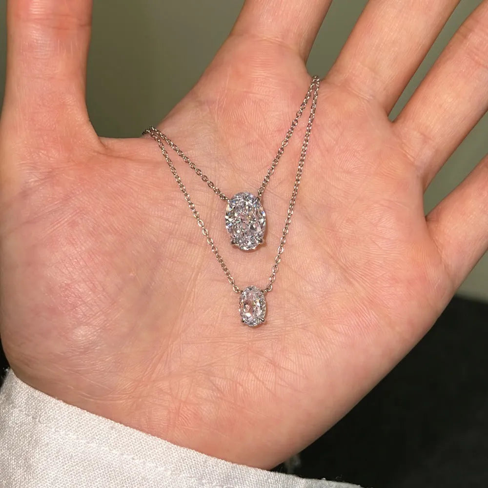 S925 sterling silver oval ice flower pendant necklace on a chain, showing geometric design.