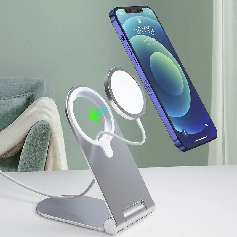 Silver vertical adjustable magnetic phone bracket for iPhone12 on a grey background.