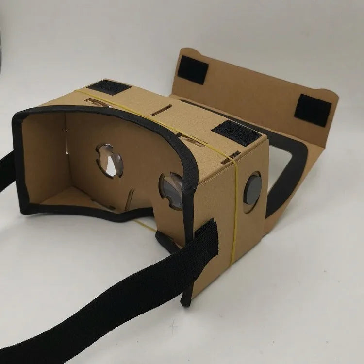 Pink and white cardboard VR glasses for smartphones with head strap and 3D lenses.