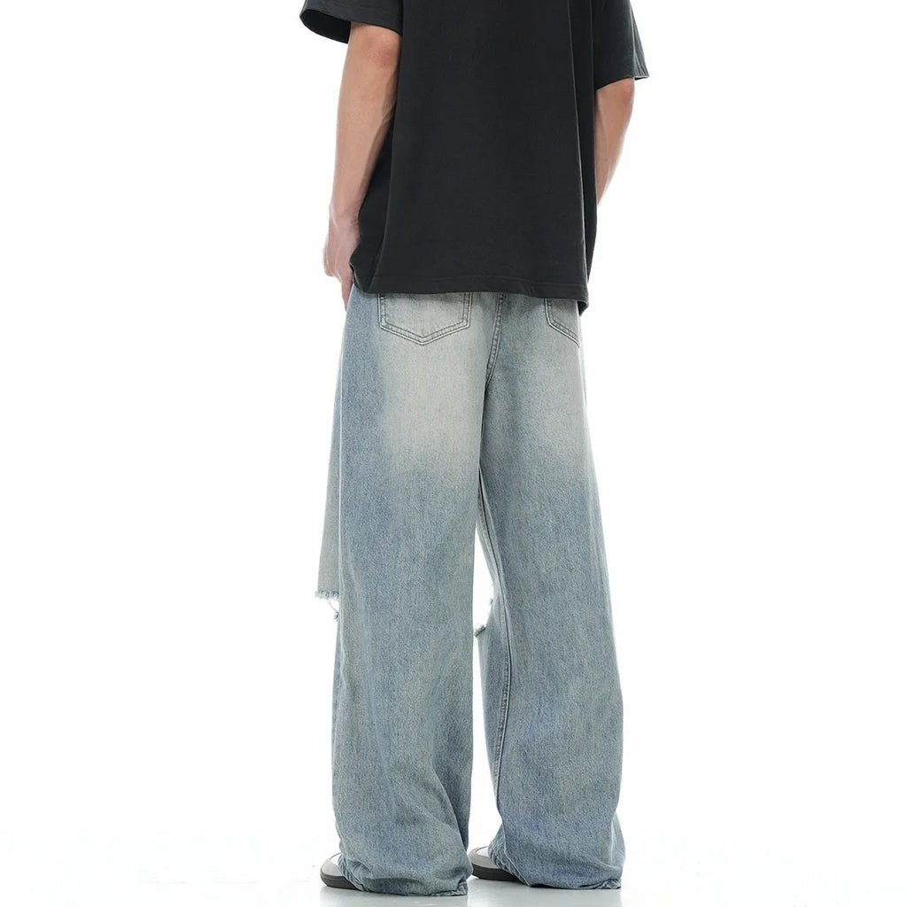 Men's blue straight-leg ripped jeans with zipper fly and retro styling in cotton blend fabric