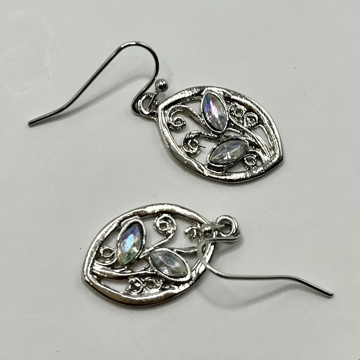 Silver colour leaf-shaped women's earrings with embedded colourful moonstones