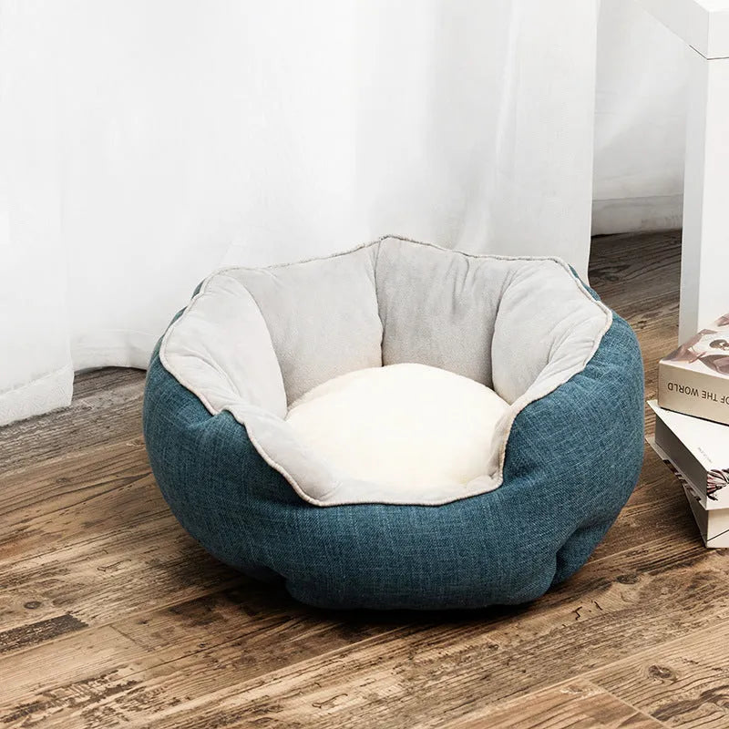 Blue octagonal pet sofa bed with a removable central mat for a small dog or cat.