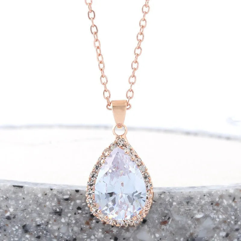 Rose gold plated drop pendant necklace with colourful rhinestones in a pink colour option.