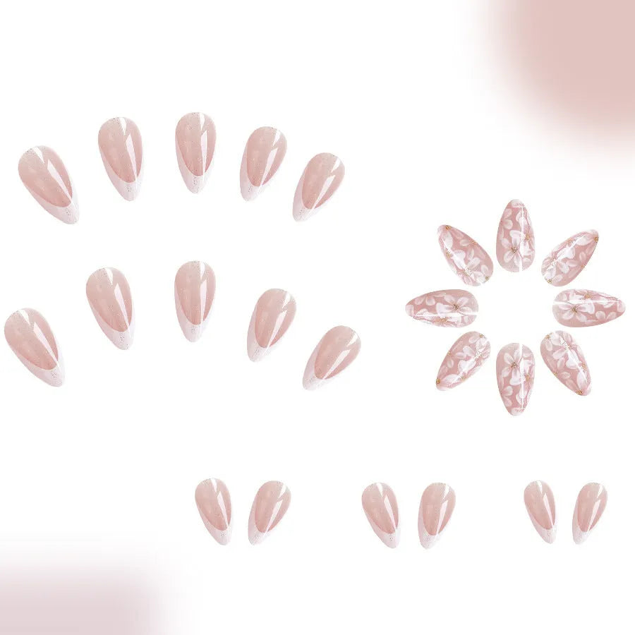 Short almond French style press-on nails with glitter flower decoration in colour C625