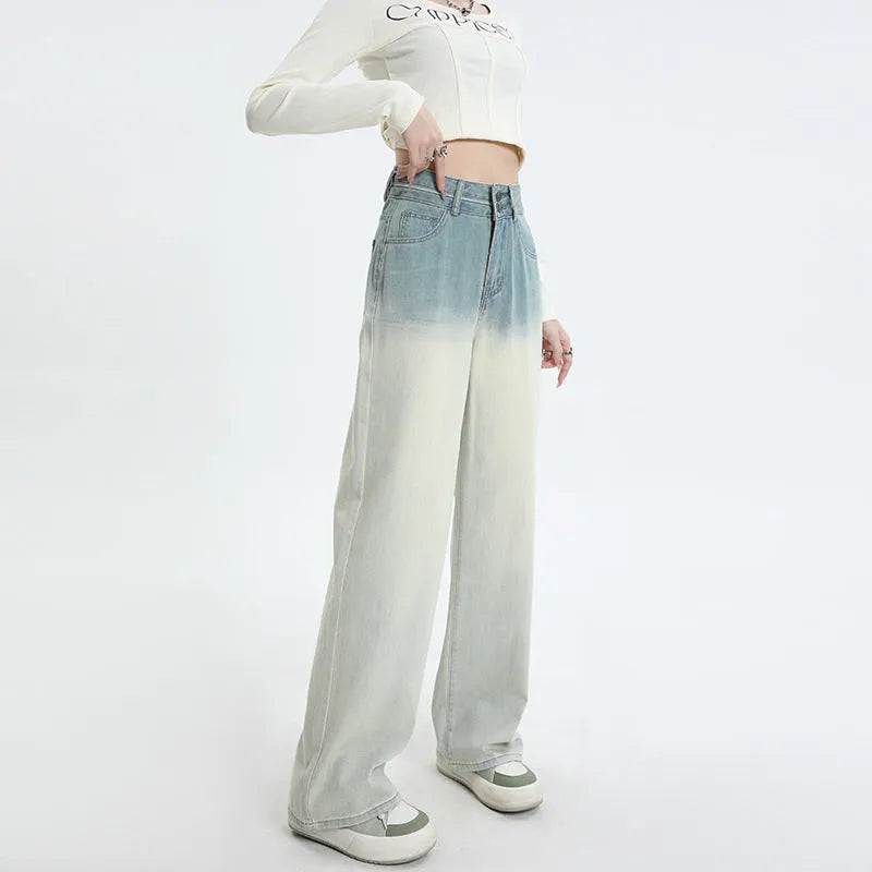Gradient blue women's straight-leg denim trousers showing colour variation from light to dark blue tones