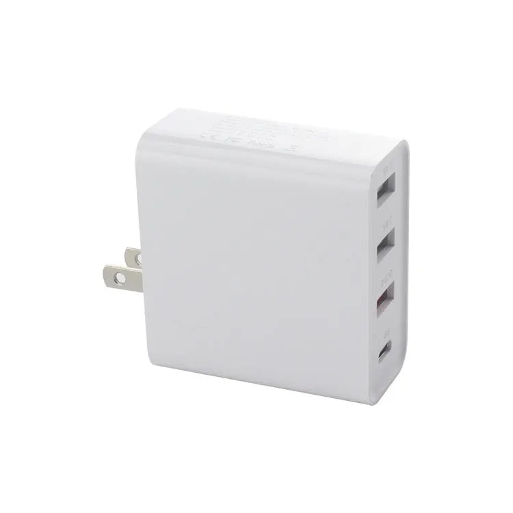 Black four-port USB-C wall charger with UK plug adapter and international travel plugs