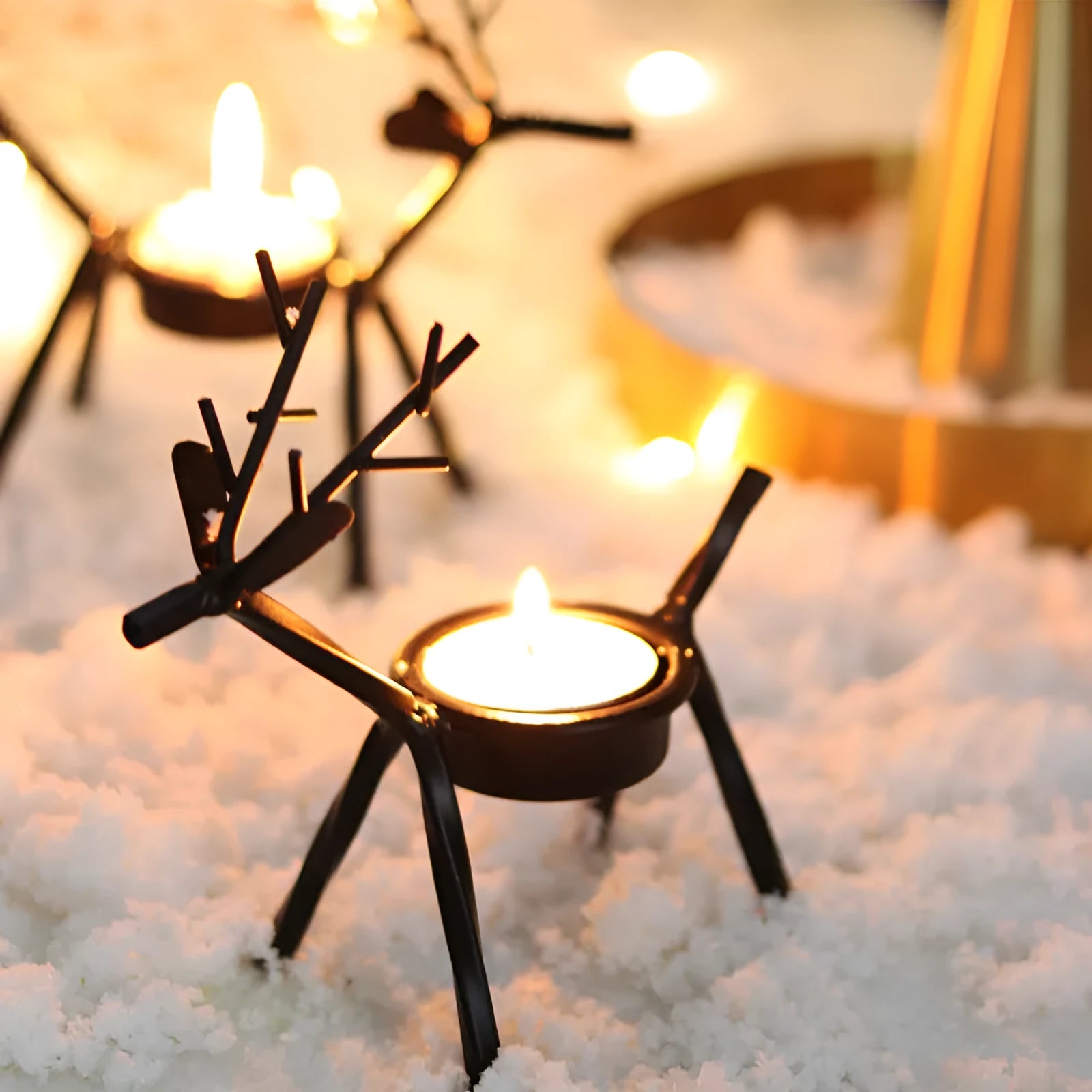 Black iron Christmas candlestick holder with detailed elk and deer design