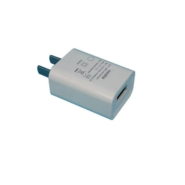Thin CE FCC certified 5V 1A USB smartphone charger on white background