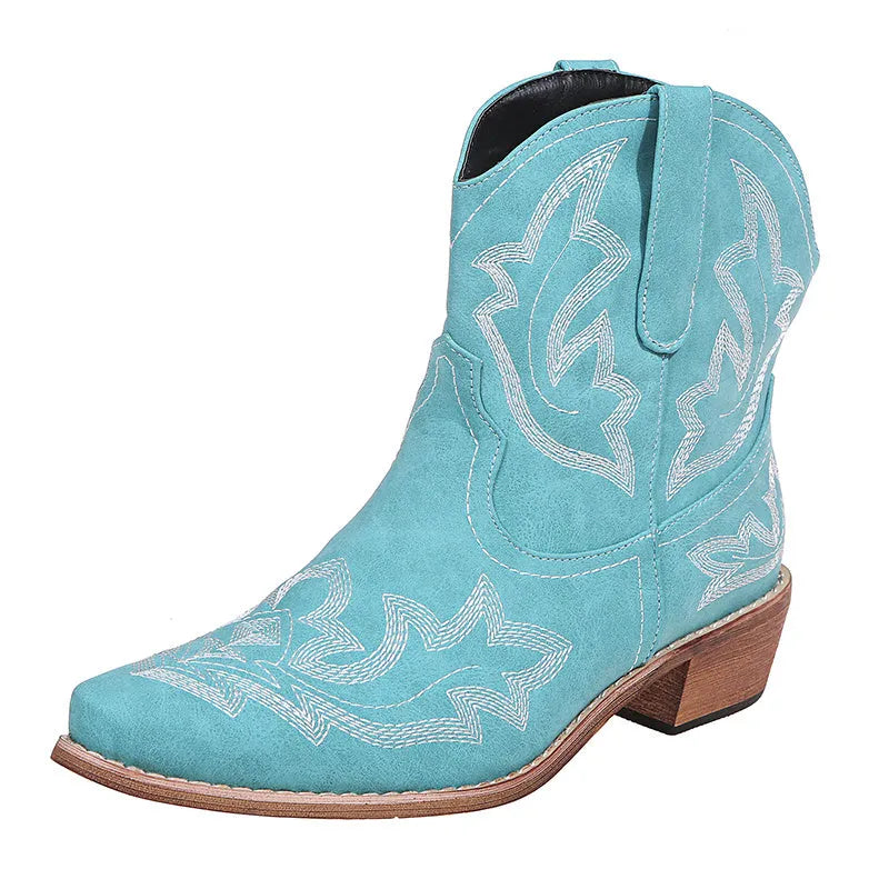 Blue women's cowboy boots with floral embroidery, a wedge heel, and a pointed toe.