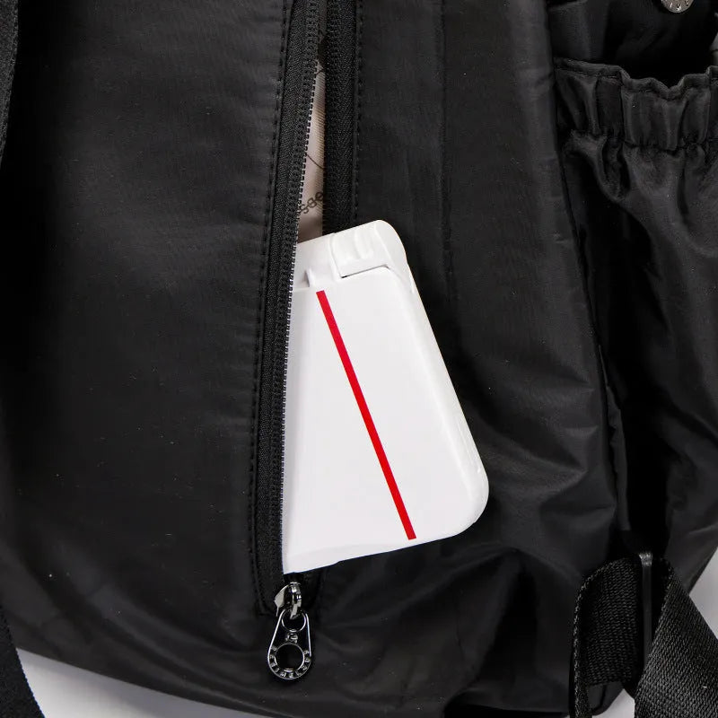 Outdoor lightweight backpack with nylon construction showing sandwich pocket design and available colour options