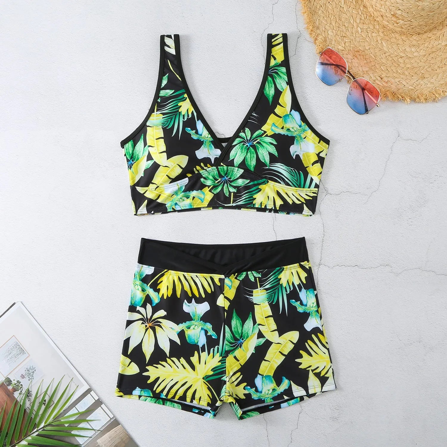 Women's two-piece swimsuit set with sleeveless top and printed boxer-style briefs in multiple colours.