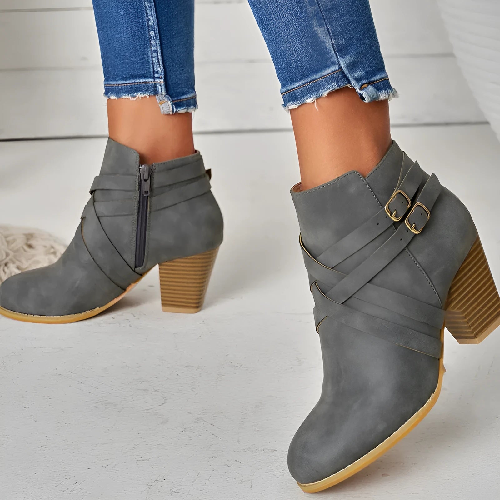 Plus size black short boots with a side zipper, buckle, and a 7cm stout heel on a rubber sole.