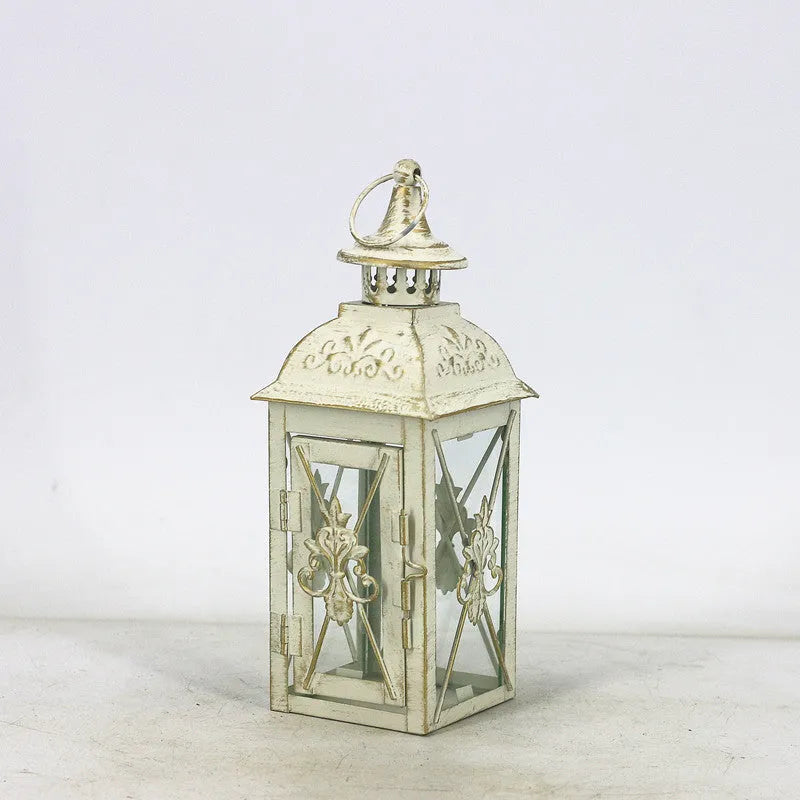 European black and white wrought iron floor-standing storm lantern with tempered glass in three sizes for courtyard decoration.