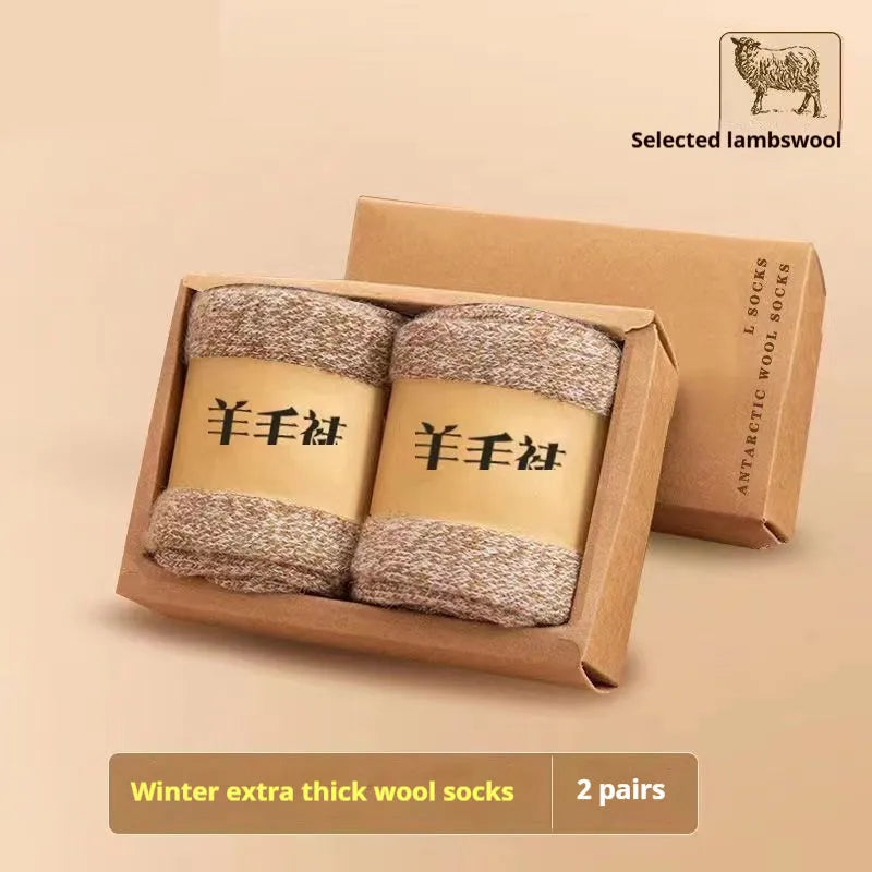 Pair of thick solid-colour wool socks with a merino midsole, shown with a storage box.