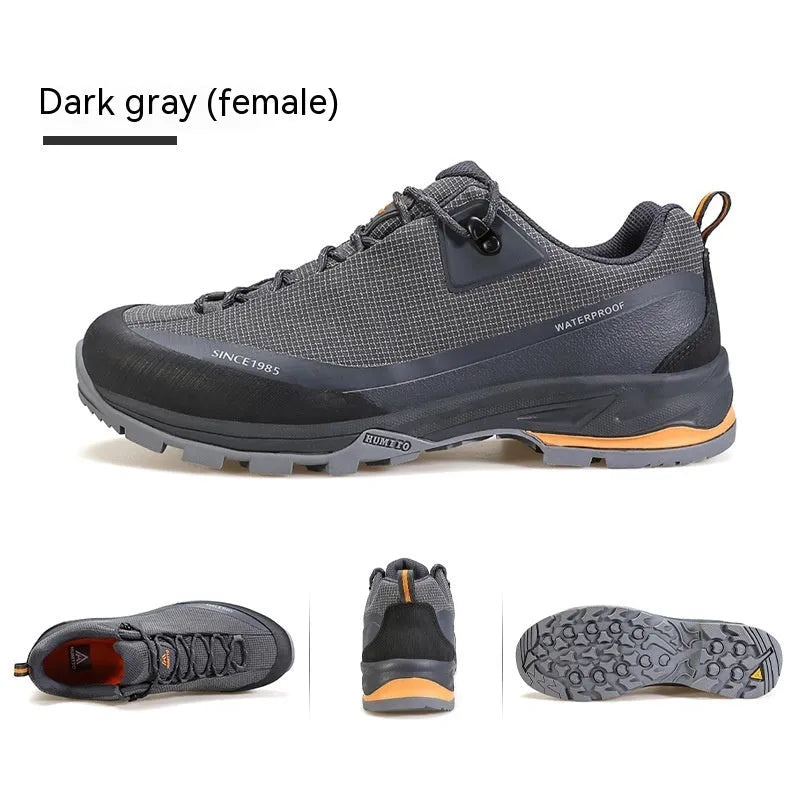 Men's low-top mountain climbing shoes in black with non-slip rubber outsole and lace-up design