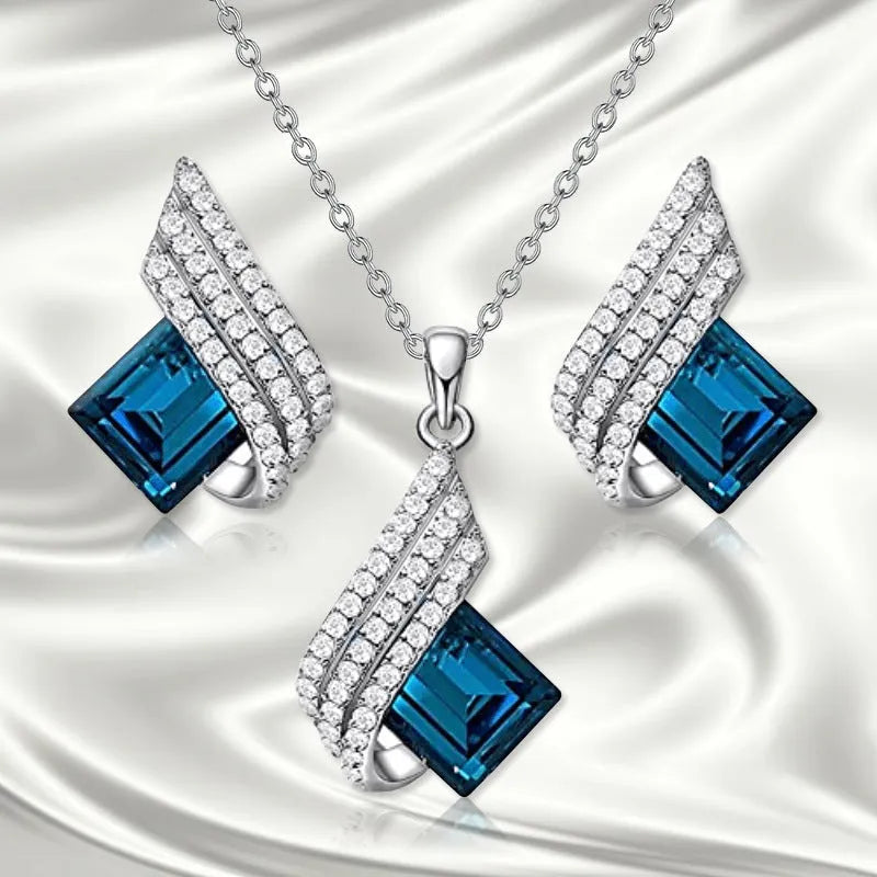 Gold-toned women's necklace and earring set with alloy, glass, and a cross chain, shown in two style options.