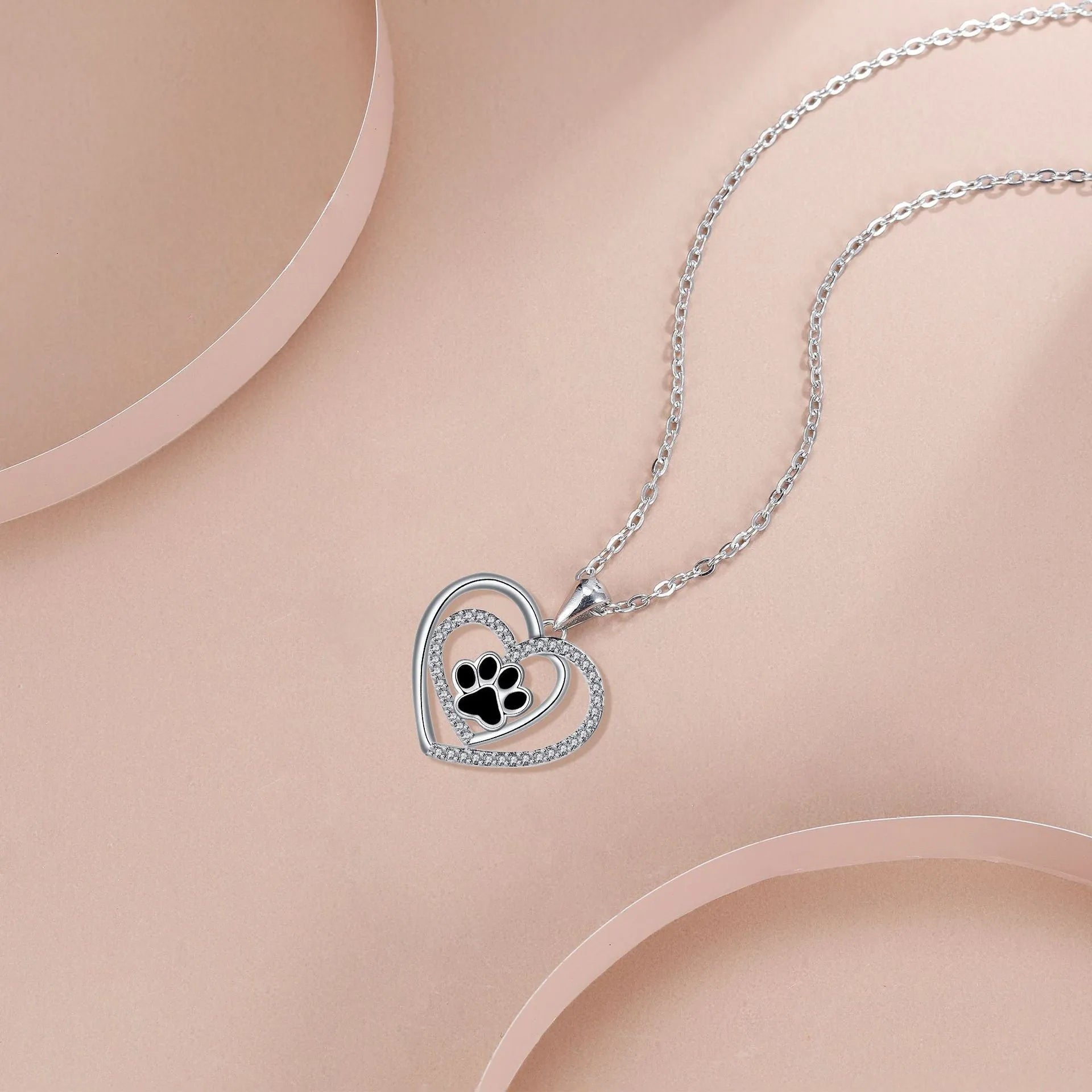 Women's copper dog paw heart necklace with cross chain in electroplated finish
