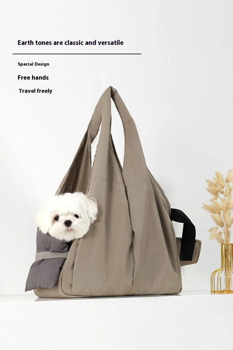 Apricot coloured cloth pet handbag measuring 41cm by 16cm by 28cm