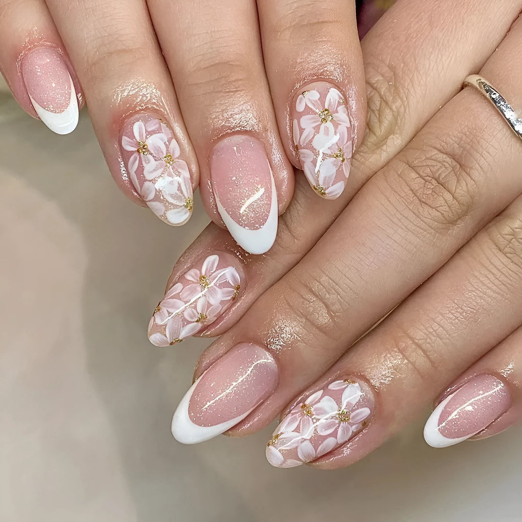 Short almond French style press-on nails with glitter flower decoration in colour C625