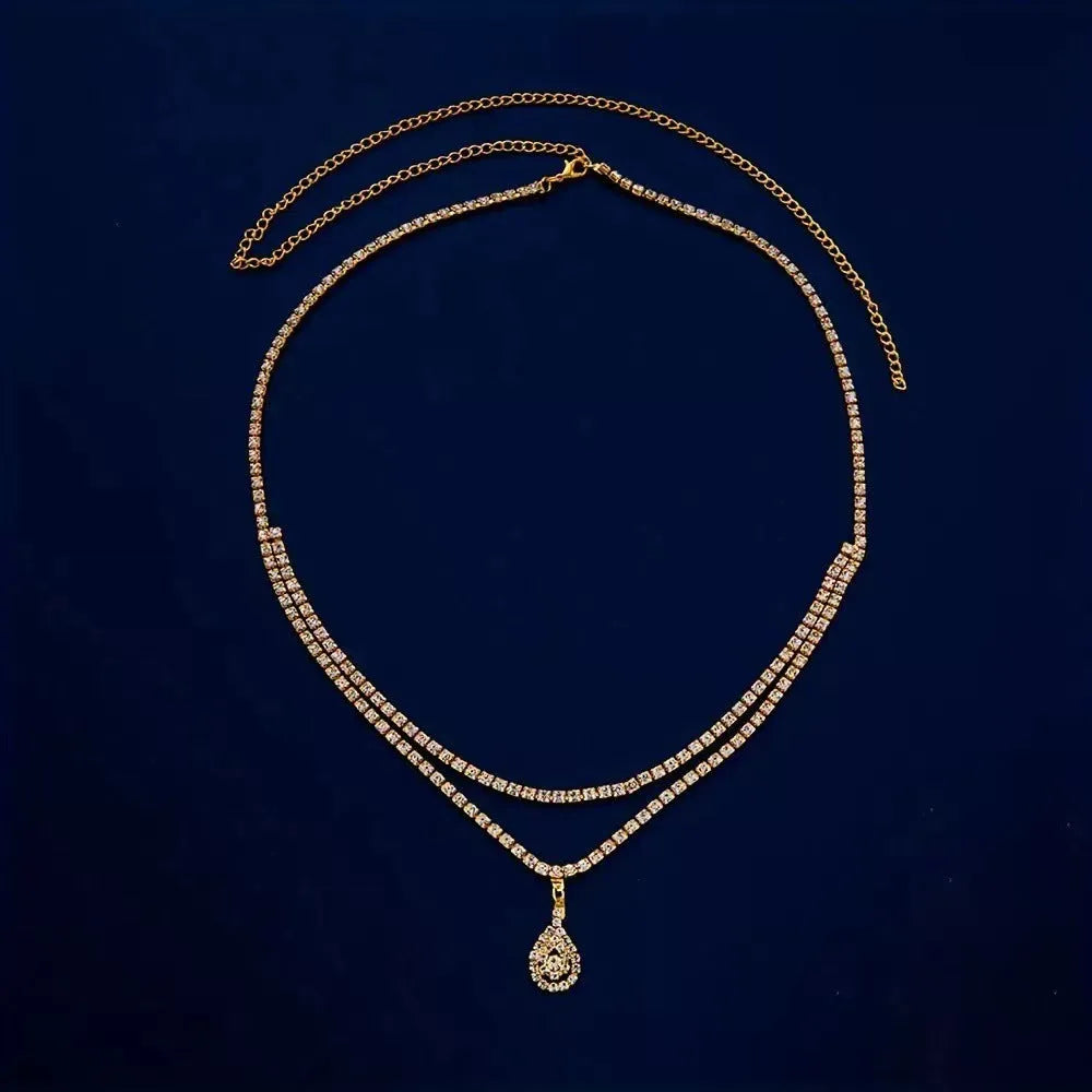 Gold or silver women's waist chain with water drop rhinestone pendant and tassel, 115cm long.