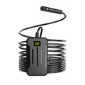 Wireless endoscope with dual-lens camera, magnet, and hook accessories on a table