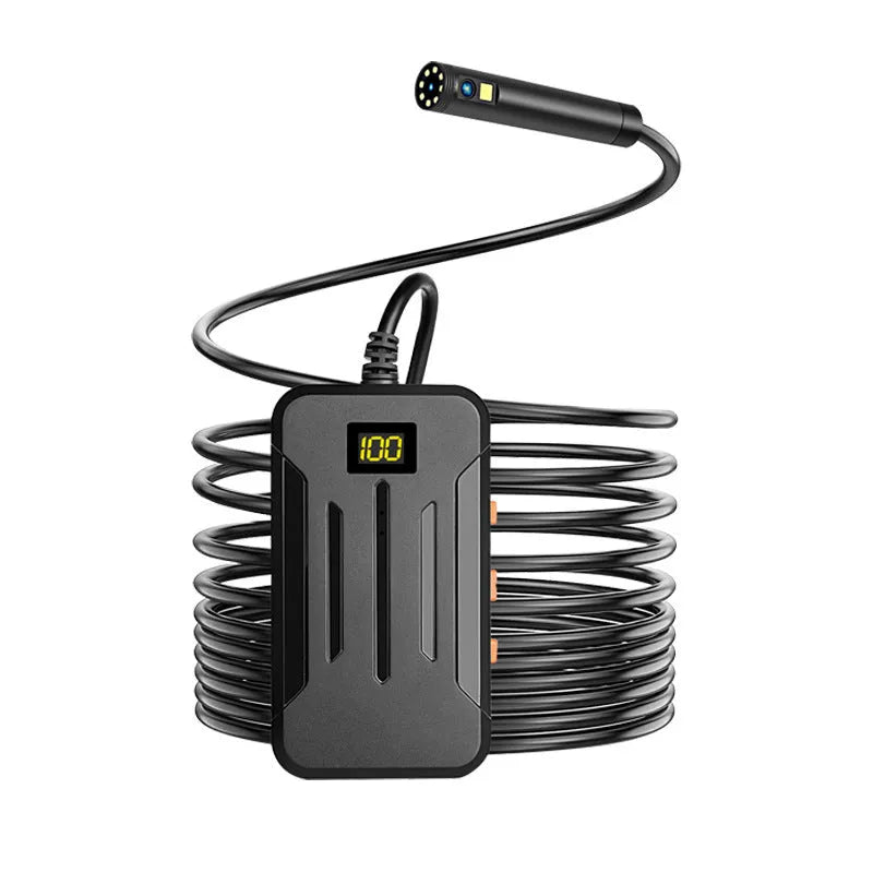 Wireless endoscope with dual-lens camera, magnet, and hook accessories on a table