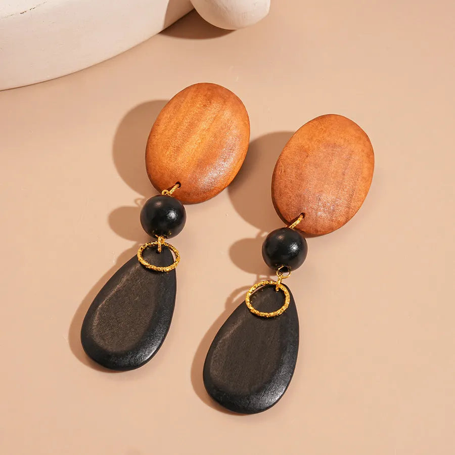 Manual wooden retro earrings with ellipse design in silver brown black colour