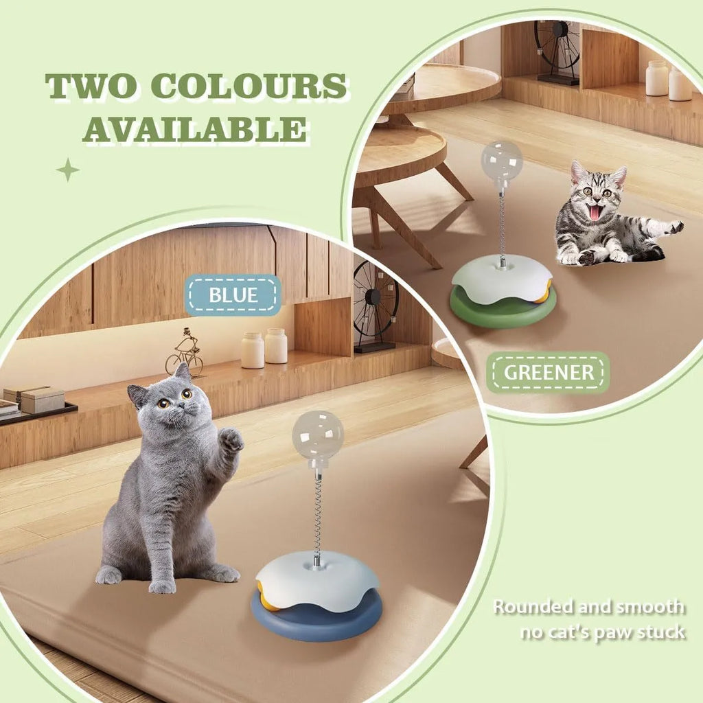 Blue and green cat treat dispenser toy with track ball on a wooden floor