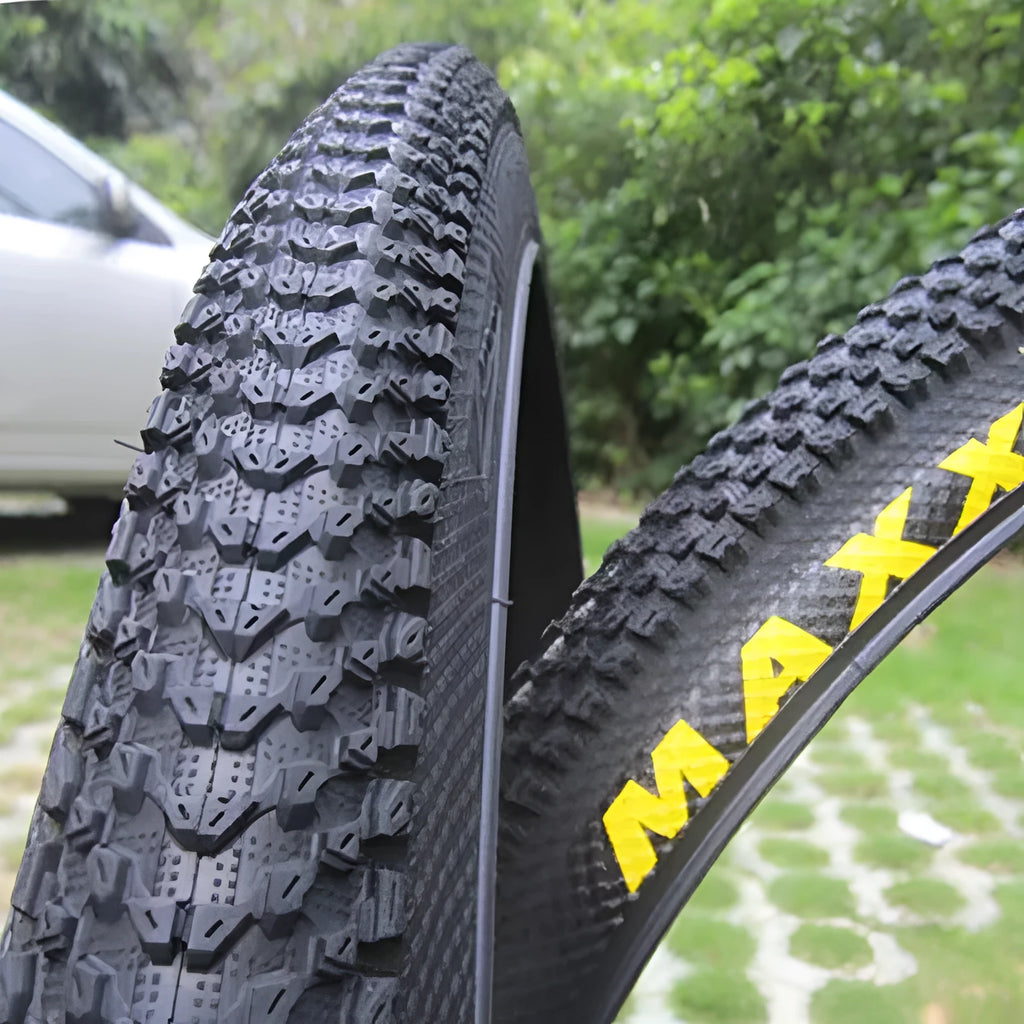 Ultralight puncture-proof mountain bike tyre shown in black with aggressive tread pattern.