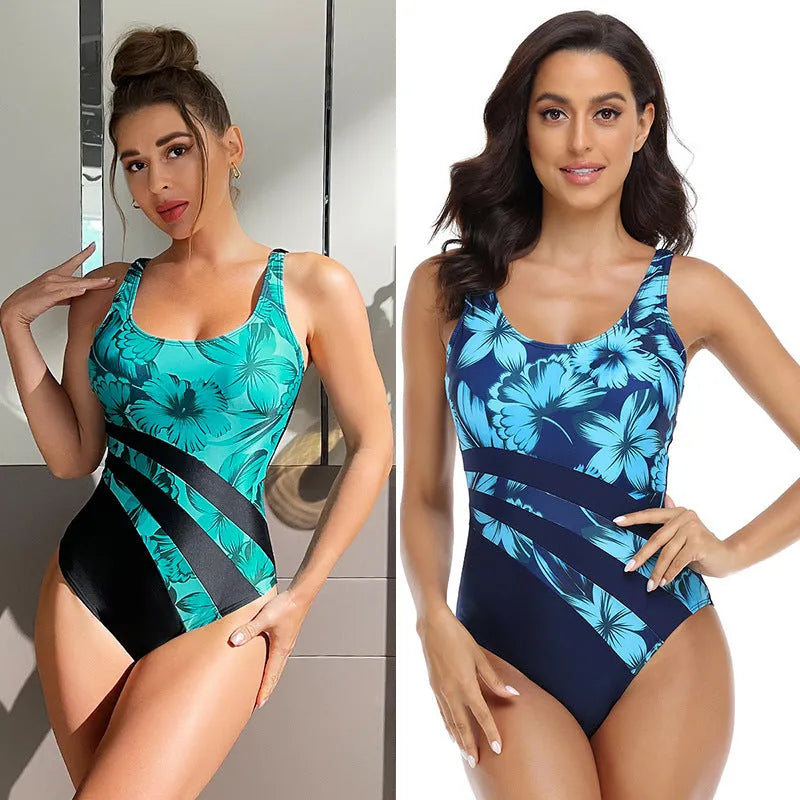 Blue and green printed women's conservative one-piece swimsuit on a hanger.