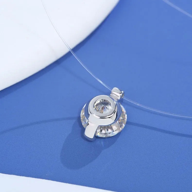 Women's silver clavicle chain necklace with a floating moissanite stone and plum blossom detail.