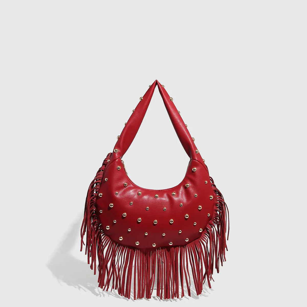 Retro tassel shoulder handbag in black or wine red showing integrated phone compartment and structured design