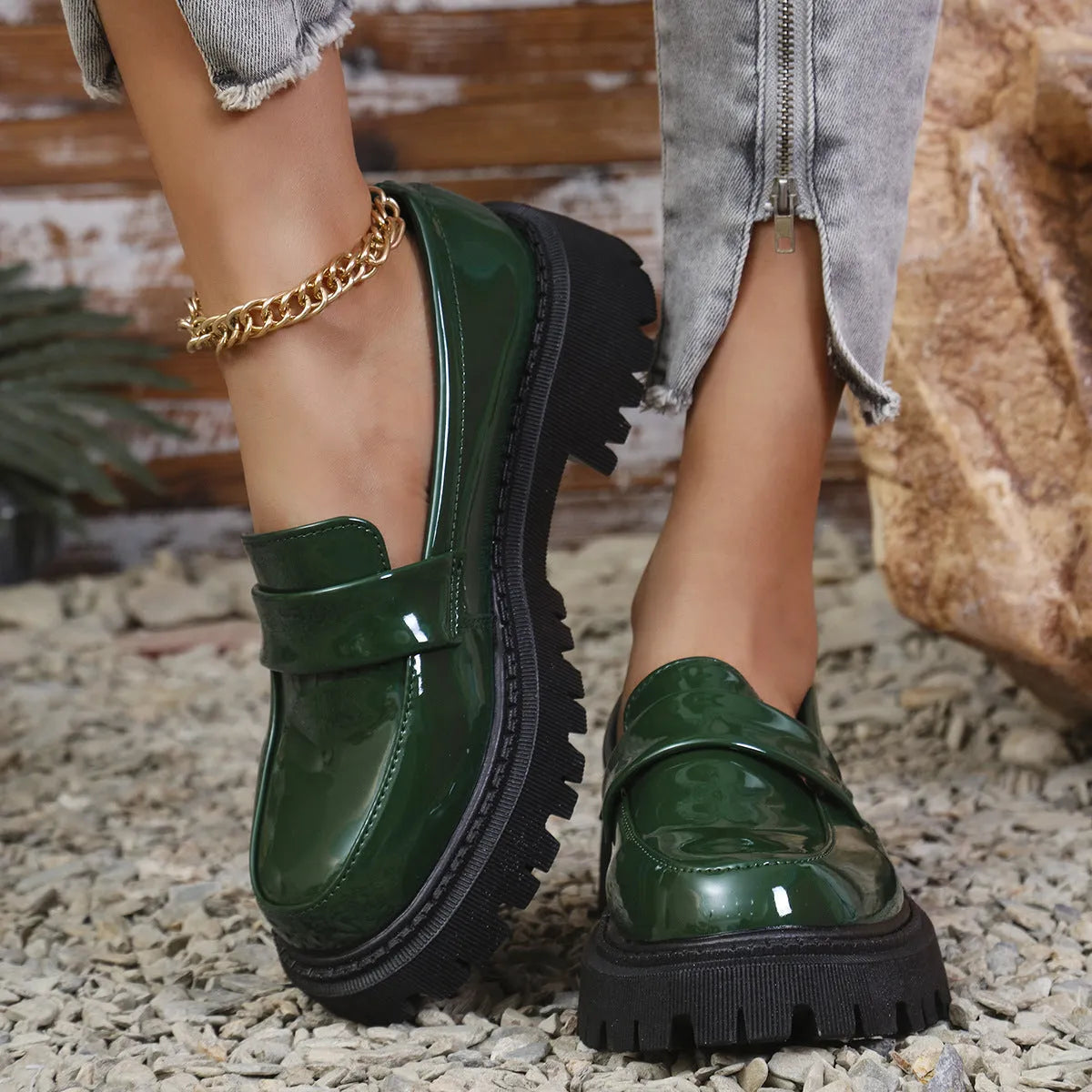 Plus size women's slip-on loafers with a chunky platform heel in black, green, and wine red colours.