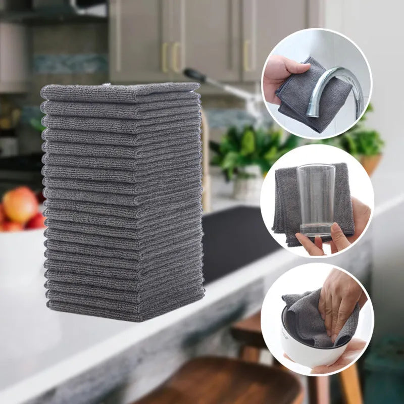 Grey square microfiber kitchen cleaning cloth for oilproof decontamination of pots and bowls.