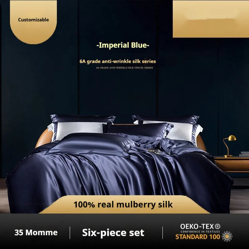 Silk four-piece quilt cover set in a solid colour displayed on a bed, showing the quilt cover and matching pillowcases.