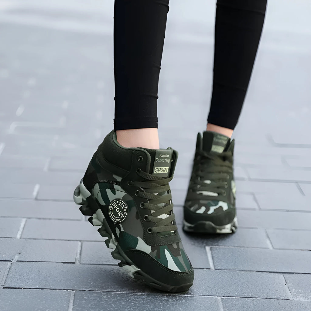 Women's green camouflage canvas sneakers with rubber soles shown in casual setting