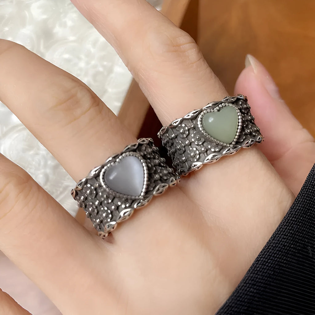 Retro wide-faced heart ring with adjustable opening in white copper plated silver