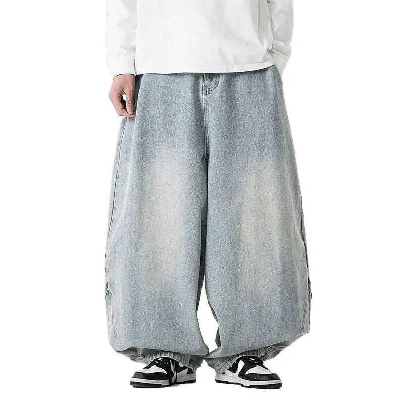 Men's plus size light blue wide leg baggy jeans on a neutral background