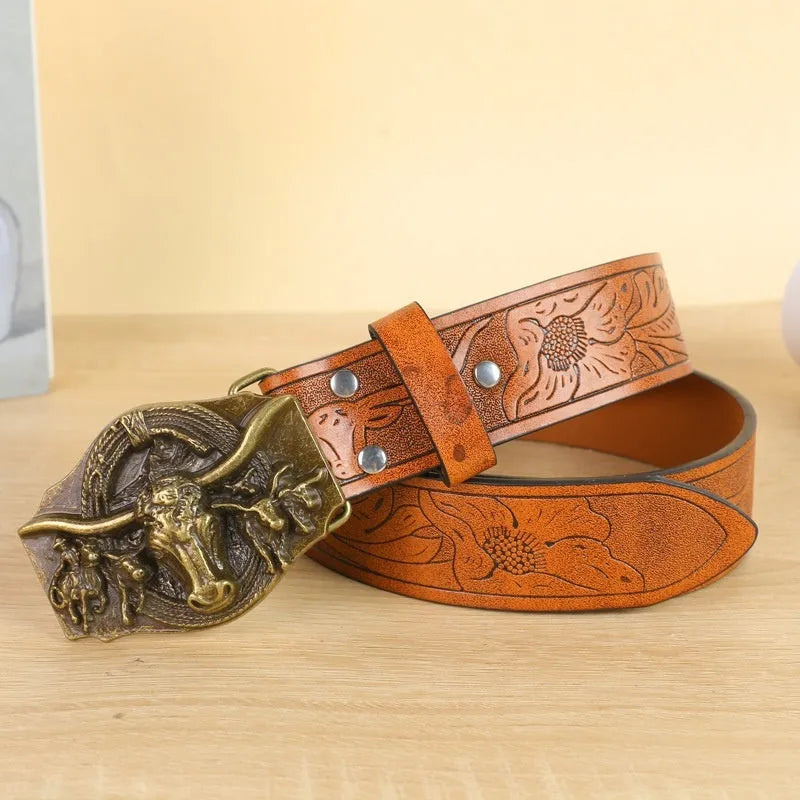 Men's brown leather-look belt with a detailed metal cow head buckle showing carved and embossed details.