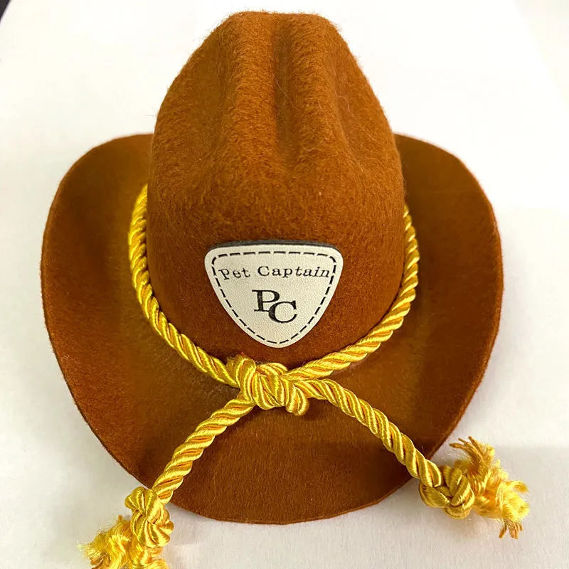 British cowboy-style hat for a cat on a mannequin head, showing brown colour with a black ribbon trim.