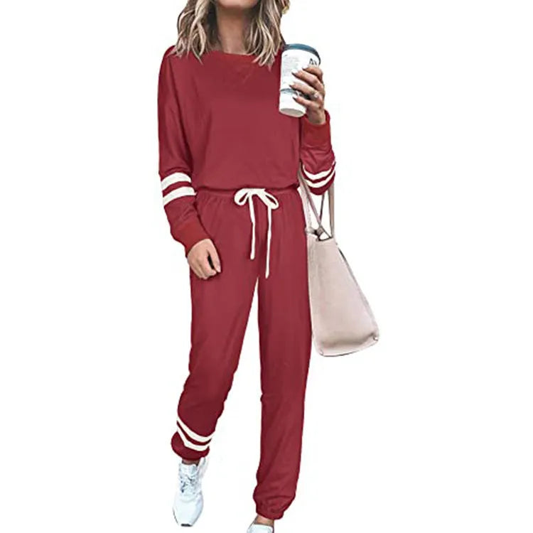 Women's plus size casual suit set in loose-fitting design with half-sleeve top and solid colour trousers