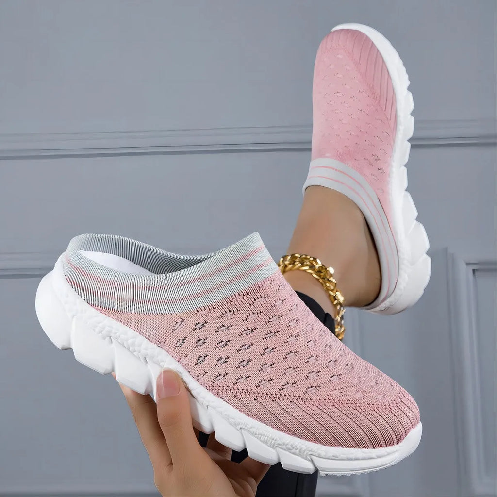 Women's black Flyknit slipper shoes with striped pattern and hollowed-out design on a viscose sole.