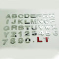 Metal car bumper stickers showing 3D raised English alphabet letters in silver finish