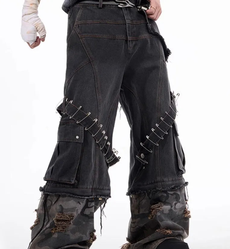 Grey men's camouflage print jeans with structural splicing and ribbon detailing on cotton denim.