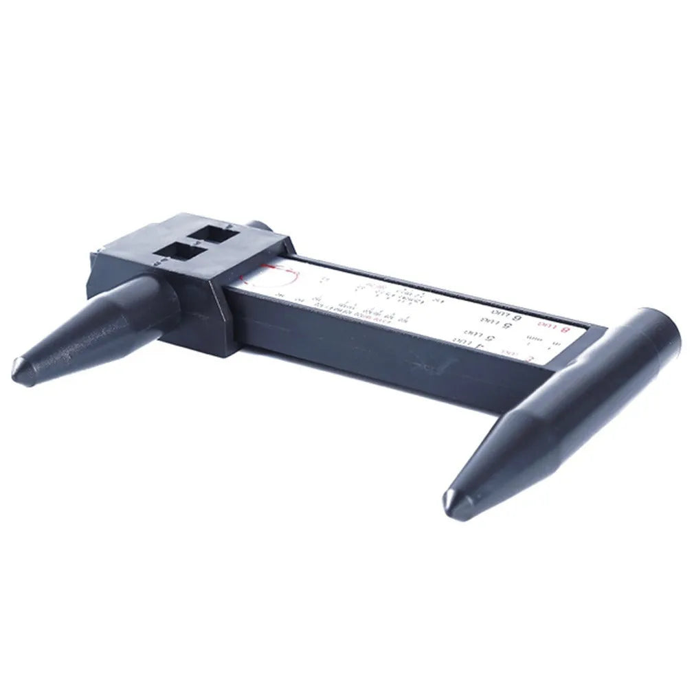 Electronic digital caliper hole distance measuring tool on a workshop bench